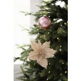 Blomst på klype gull i juletre