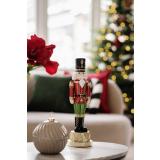 Tinnsoldat på sofabord med julekule krukke beige