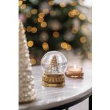 Snøkule Teddy på sofabord med duftlys