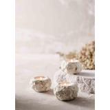 Batu Telysholder på steinoverflate