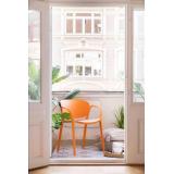 Utestol sol i oransje på balkong