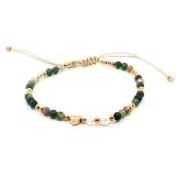 Knytearmbånd med grønne stener