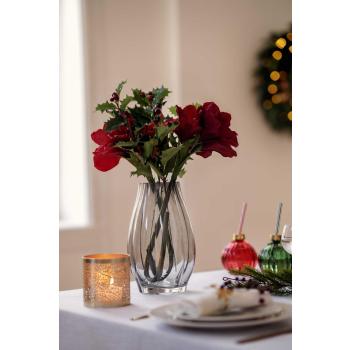 Stilkblomst Amaryllis rød på dekt spisebord