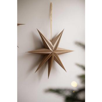 Adventsstjerne Gull hengende på vegg