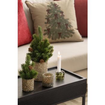 Telysholder glitter med plante grann på sidebord