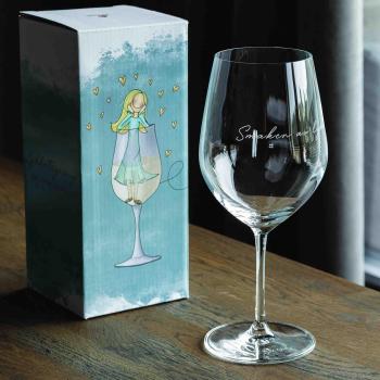 Lykketegning Rødvinsglass smaken av lykke med gaveeske på bord