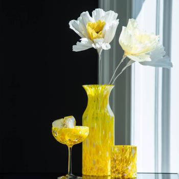 Gult swirl champagneglass fra Magnor