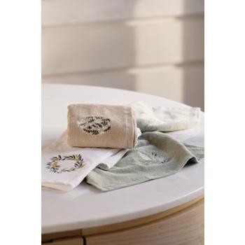 Gjestehåndkler med broderte motiv på kjøkkenbenk