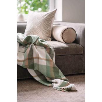 Pledd Tartan liggende på en sofa