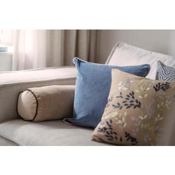 Sofakrok med puter i blå og beige toner