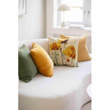 Putetrekk i grønn og gule toner i sofa