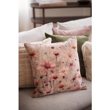 Blomsterpute som del av en dekorativ putemiks i sofa