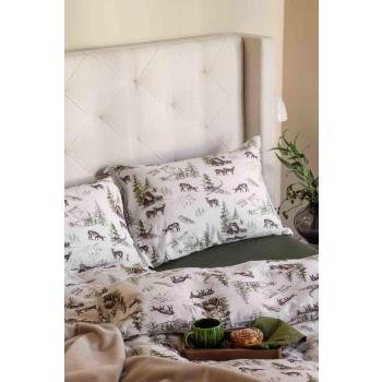 Seng med flanell sengetøy med vintermotiv og grønt laken