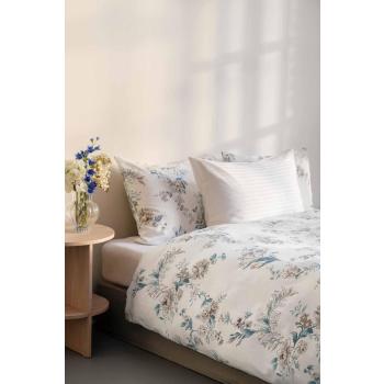 Jersey stretch laken på seng med satengsengesett