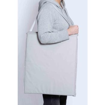 Strandmatte over skulder