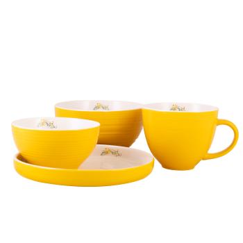 Påskeservise i gult med hvit innside og dekor av blomster