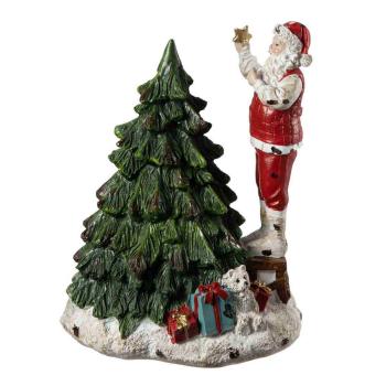 Dekortre med julenisse som pynter juletre